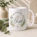 Be Still inspirational 11oz white ceramic mug with sage green botanical design and soft gold sun detail