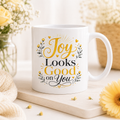Joy Looks Good on You 11oz white gloss ceramic mug with yellow floral inspirational design