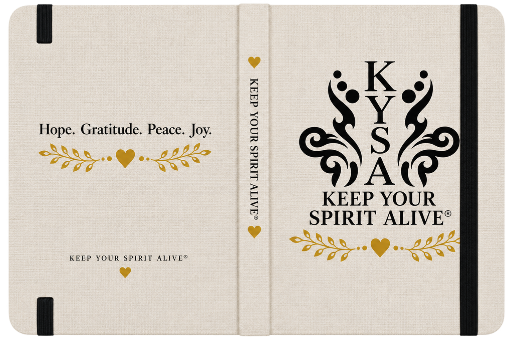 A hardcover journal or notebook shown closed, with a cream linen-textured cover and black elastic closure bands. The front cover reads 'Hope.