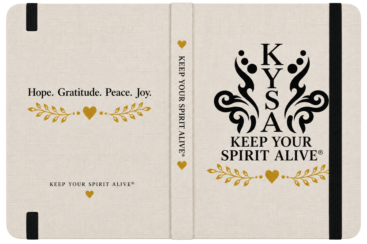 A hardcover journal or notebook shown closed, with a cream linen-textured cover and black elastic closure bands. The front cover reads 'Hope.