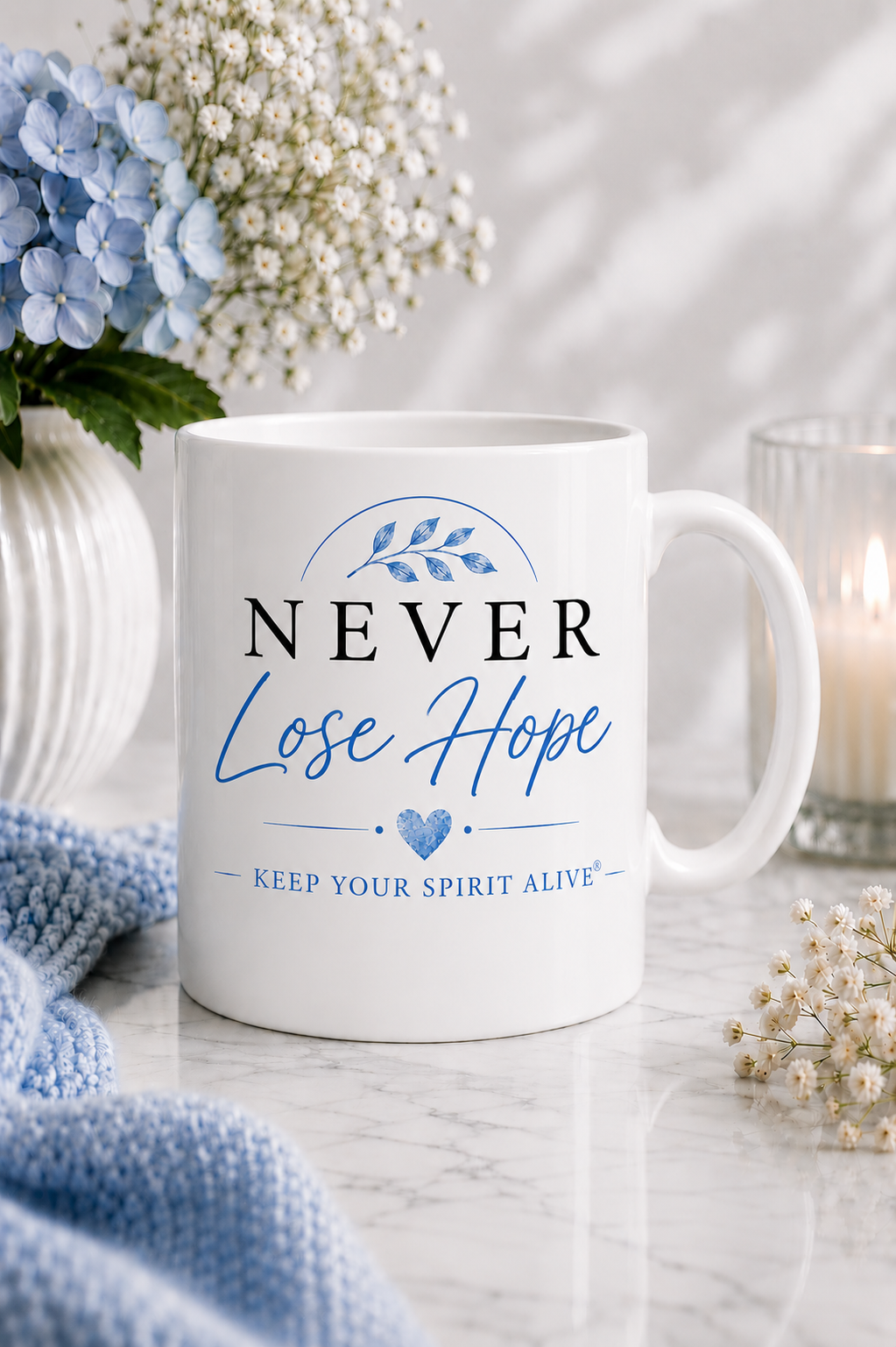 White gloss ceramic mug featuring the Never Lose Hope Signature Edition design in elegant blue and black from the Keep Your Spirit Alive® collection.