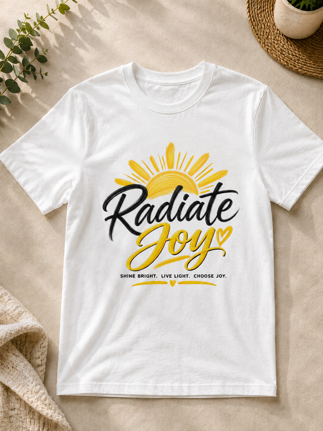 White Radiate Joy inspirational T-shirt with yellow sun and black and gold lettering by Keep Your Spirit Alive®